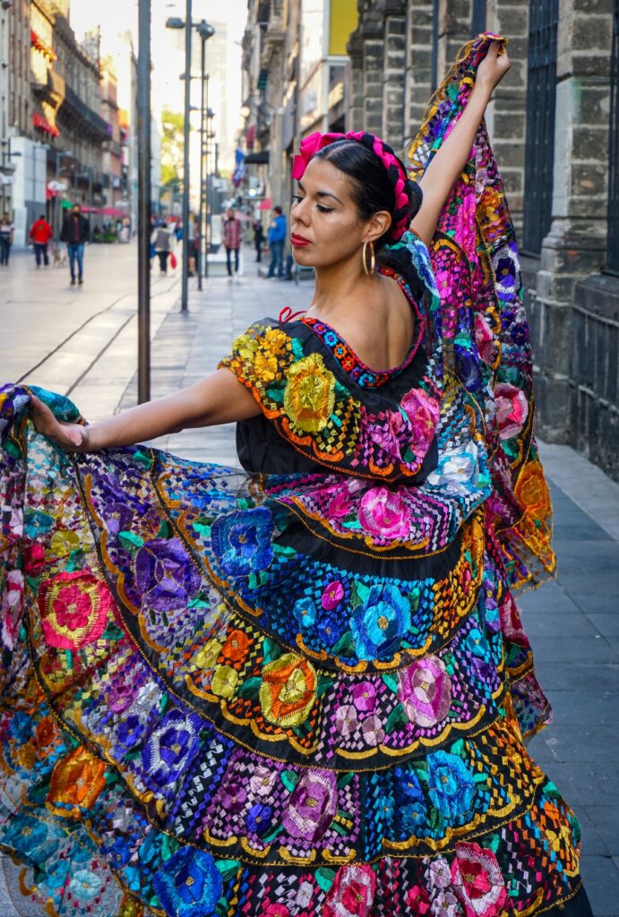 Malaga holidays 2024. Woman wearing a colorful flamenco dress.
