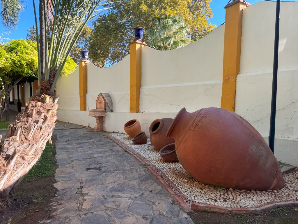 Path and vases at the Molino de Inca Botanical Garden