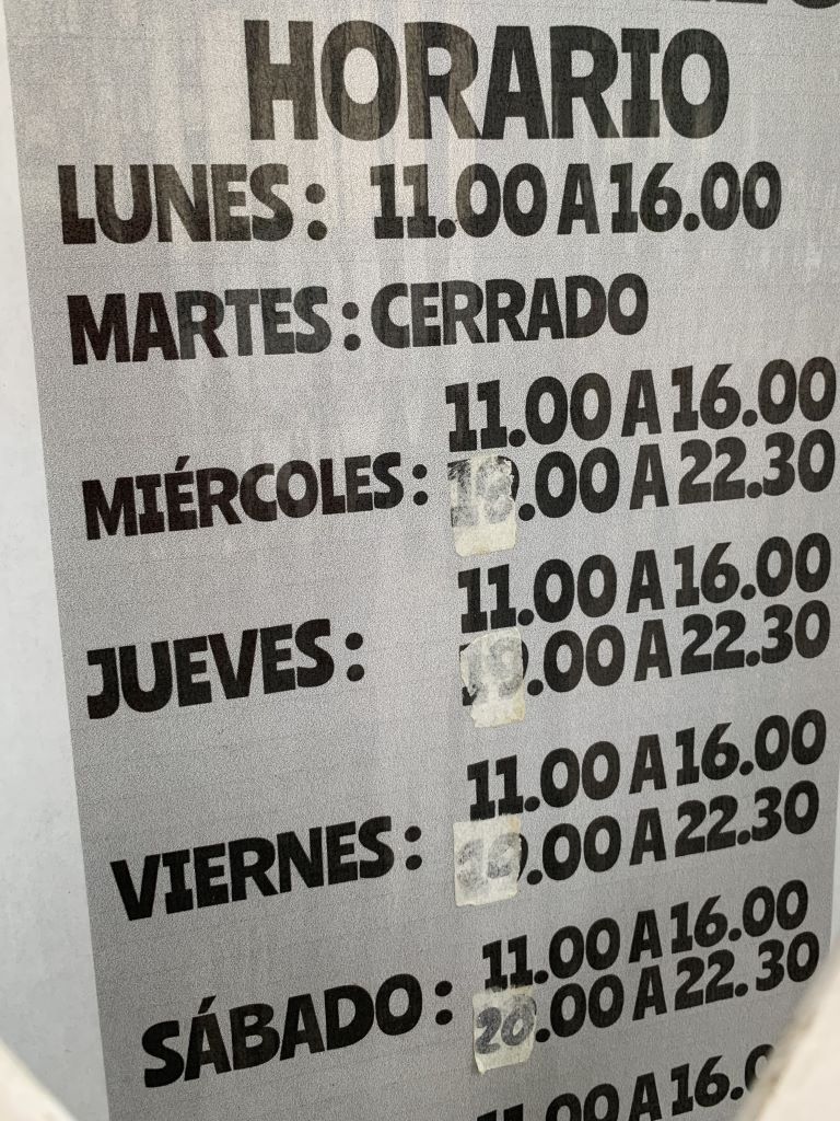 Siesta in Spain - opening hours on the doors